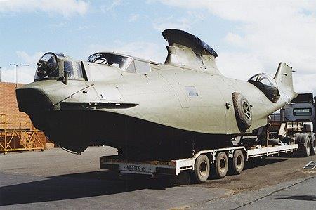 PBY hull on truck trailer, Military, Aircraft, Licensed military Cargo, Breakbulk PBY hull on truck trailer, Military, Aircraft, Licensed military Cargo, Breakbulk